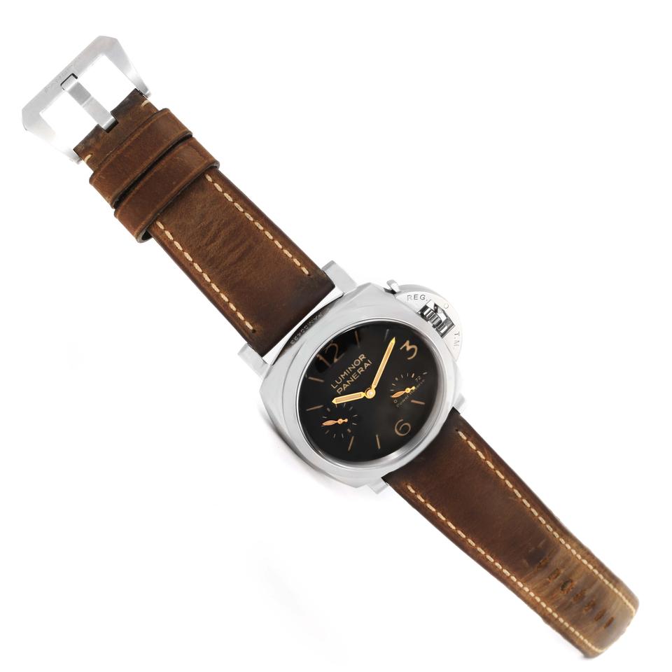 The stainless steel fake watches have brown leather straps.